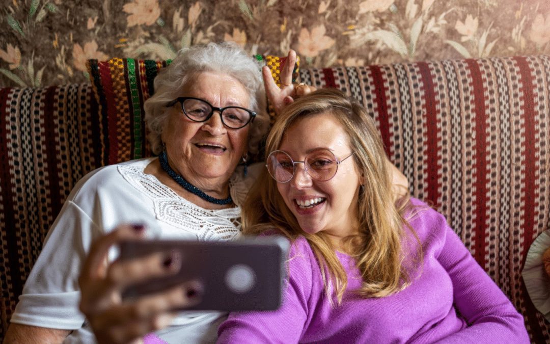 grandmother and granddaughter taking selfie 