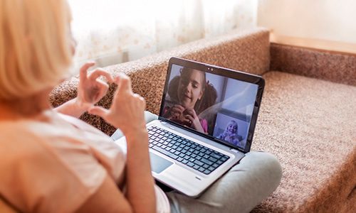 elderly women facetime with granddaughter 