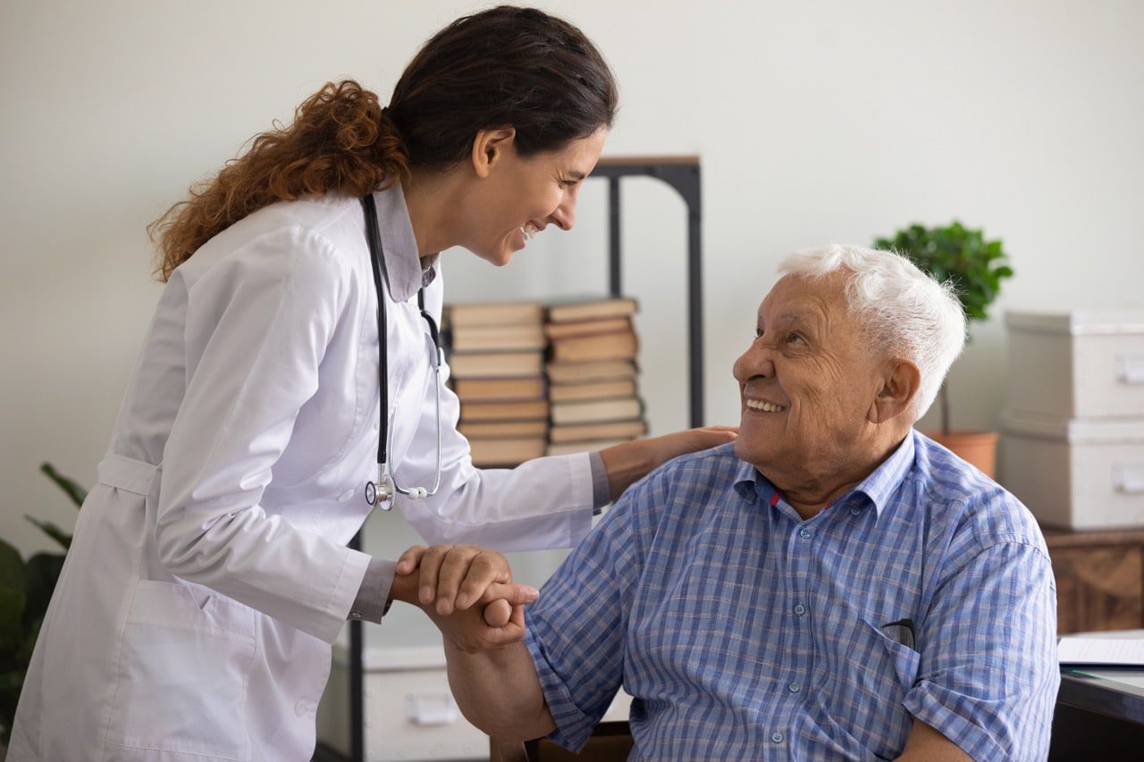 An elderly talking to a nurse about long-term care