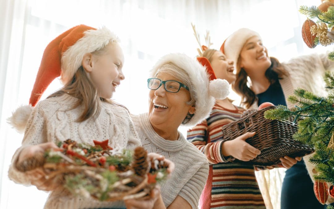 A family setting up Christmas decorations together