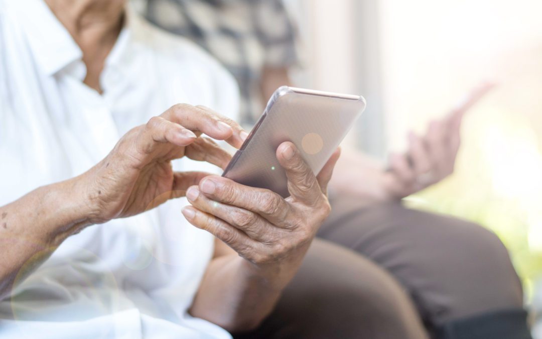 Happy elderly senior people society lifestyle technology concept. Ageing Asia women using tablet smartphone or mobile phone share social media together in wellbeing county home.
