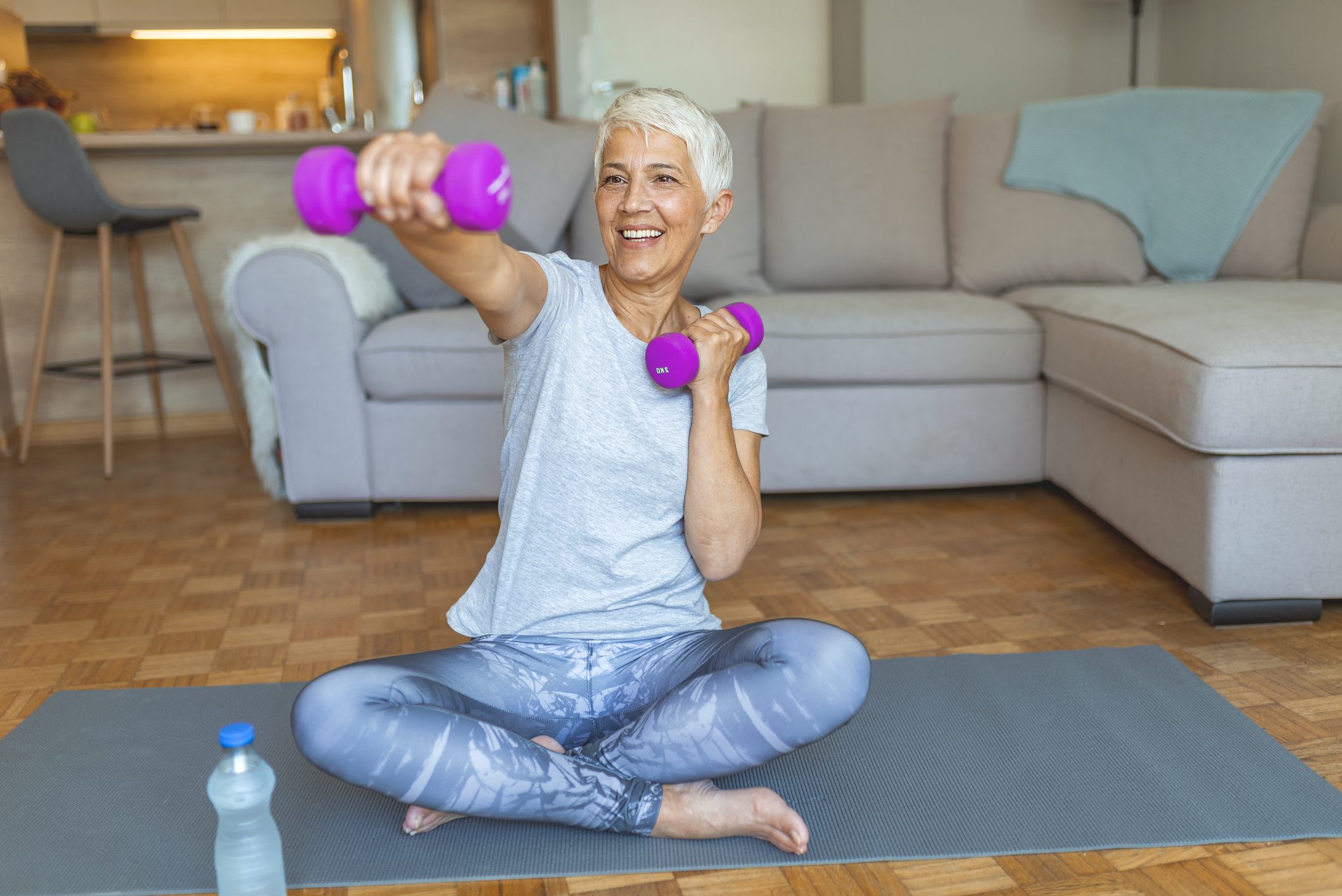 Old woman working out at home