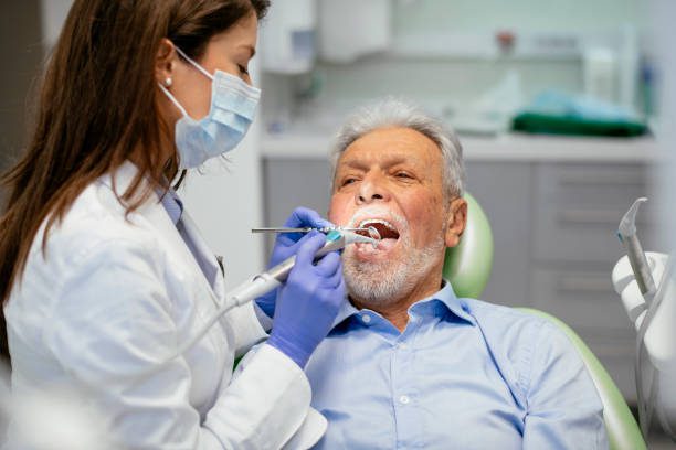Senior man at the dentist.