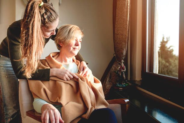 elderly woman with dementia being cared for